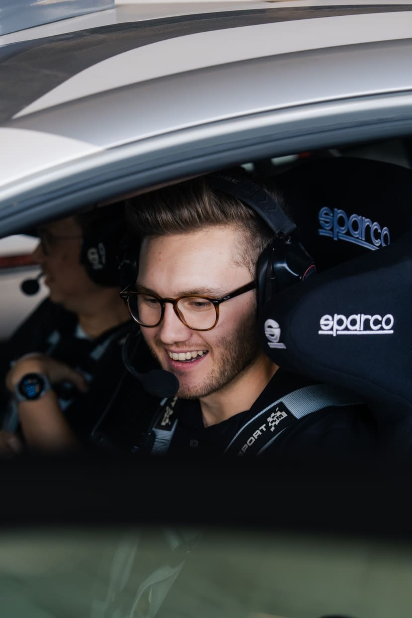 Kevin Hansen smiling inside a rallycross car cockpit